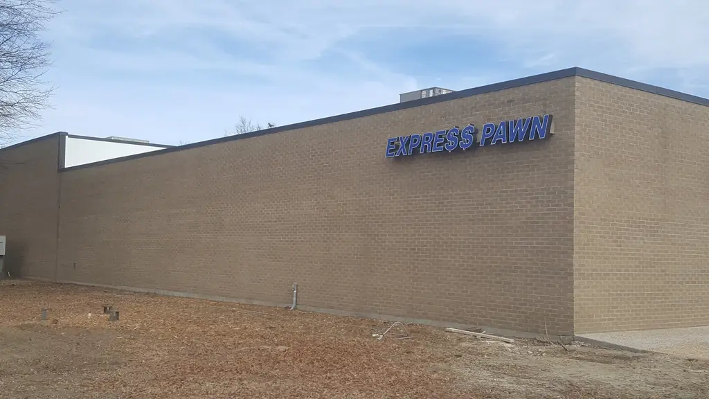 Blue EXPRESS PAWN channel letters on the side wall of the Paragould store